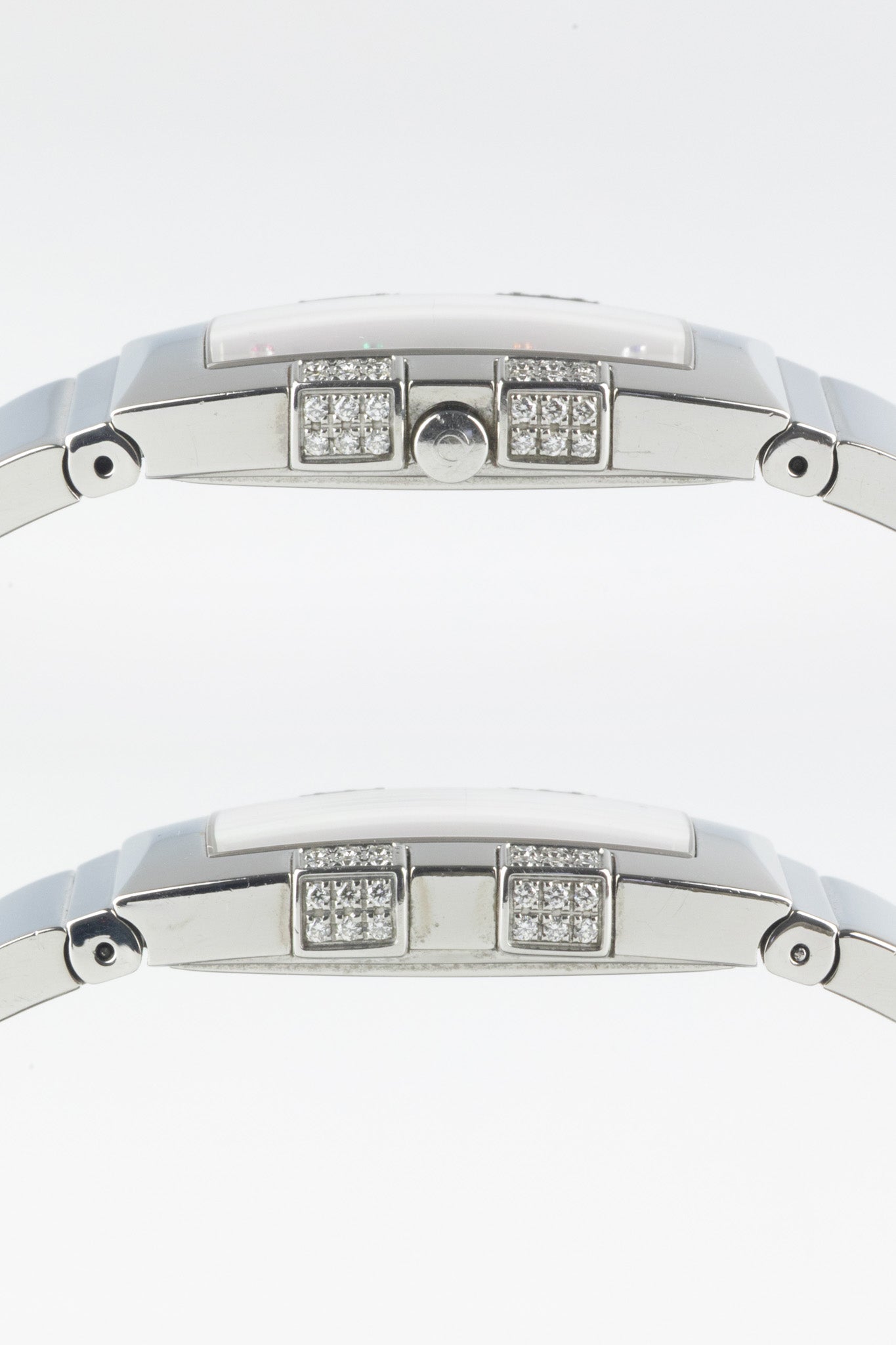 Two side-profile views showing the slim rectangular case; the top image shows the crown, while both highlight the two diamond-set decorative elements on each side.