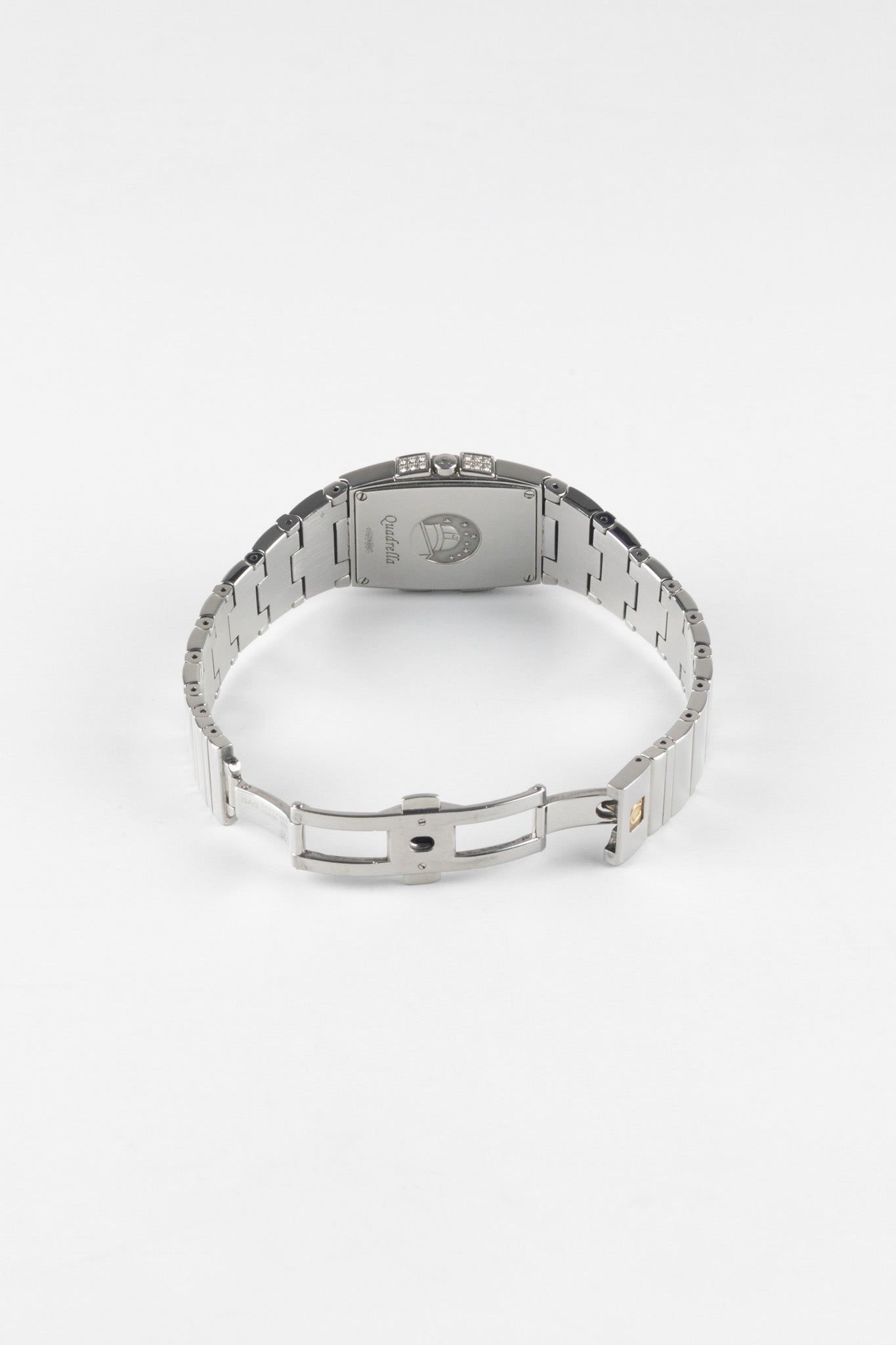 A rear perspective shot showing the stainless steel bracelet with the butterfly deployment clasp fully extended against a white background.
