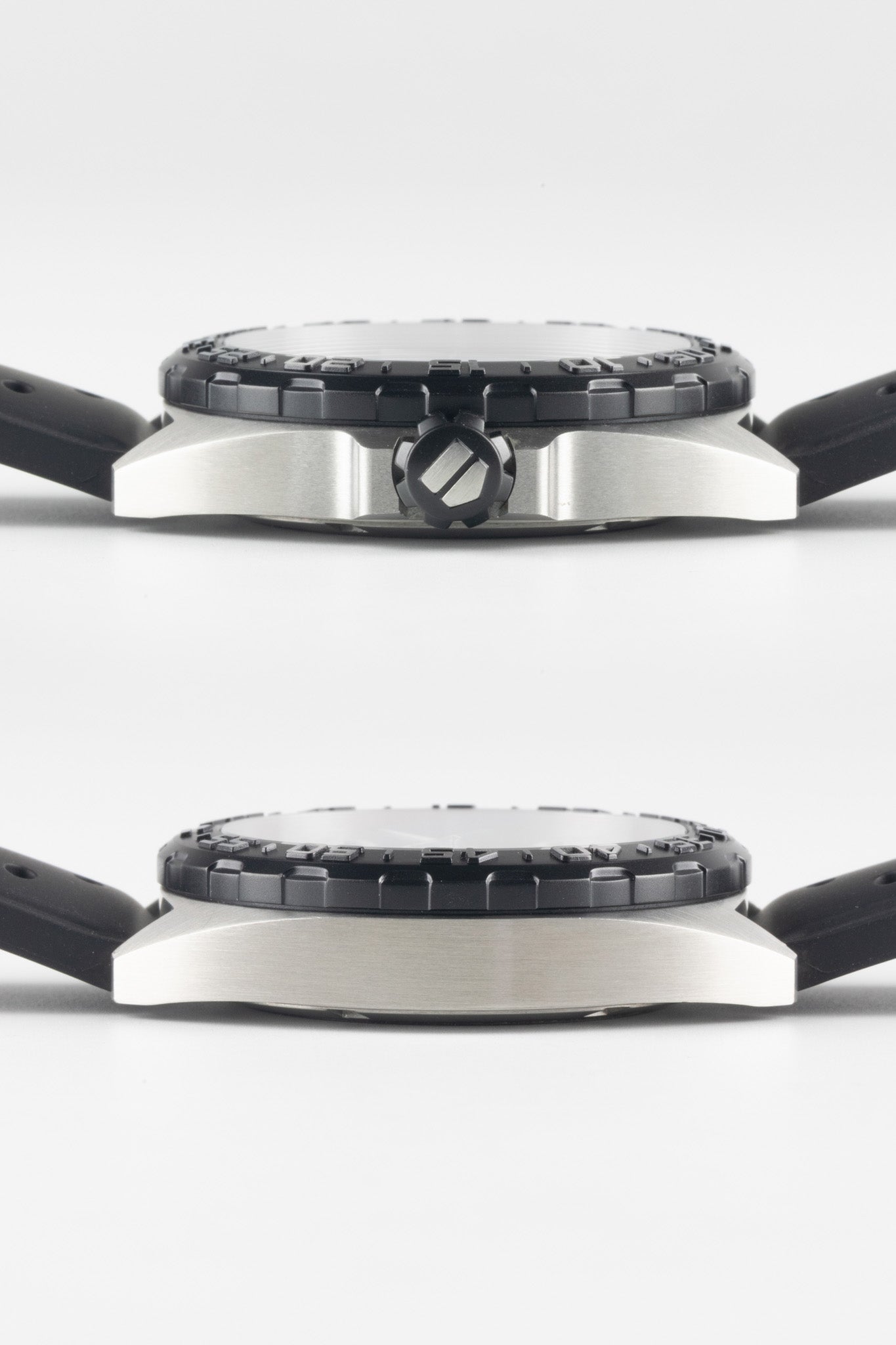 Two profile views of the watch case shown vertically; the top view shows the black textured crown with the TAG Heuer logo, and the bottom view shows the smooth side of the brushed steel case.