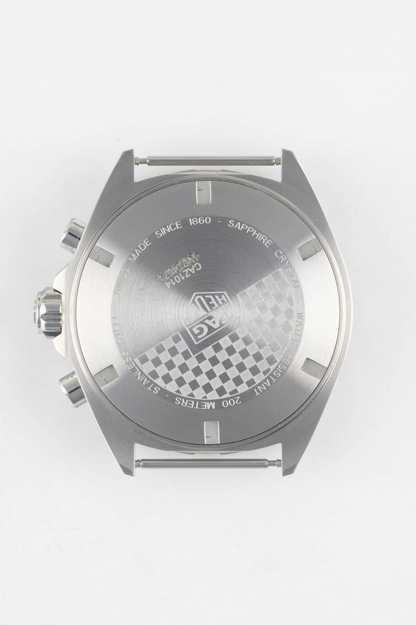 A direct shot of the stainless steel case back with a special checkered flag engraving, the TAG Heuer logo.